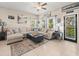 Inviting living room features tile flooring, modern furniture, and a tranquil color palette at 4740 Tuscan Loon Dr, Tampa, FL 33619