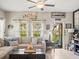 Bright living room with large windows, a cozy sofa, and decorative accents at 4740 Tuscan Loon Dr, Tampa, FL 33619