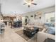 Open-concept living room with comfortable seating, dining area, and modern decor at 4740 Tuscan Loon Dr, Tampa, FL 33619