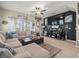 Comfortable living room with a large sectional sofa, stylish decor, and a ceiling fan at 4740 Tuscan Loon Dr, Tampa, FL 33619