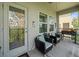 Relaxing outdoor patio featuring comfortable seating, a grill, and lush green views at 4740 Tuscan Loon Dr, Tampa, FL 33619