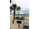 Beach with shelter and picnic tables overlooking the ocean, plus a grill for cooking and brick wall for food prep at 4837 Rainbow Race, New Port Richey, FL 34652
