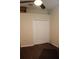 Cozy bedroom with dark wood floors, ceiling fan, and bi-fold closet doors at 4837 Rainbow Race, New Port Richey, FL 34652