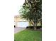 Inviting home exterior featuring a well-maintained lawn, brick-paved driveway, and an attached one car garage at 4837 Rainbow Race, New Port Richey, FL 34652