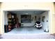 Spacious two-car garage with ample storage and parking space at 4837 Rainbow Race, New Port Richey, FL 34652