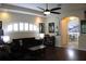 Spacious living room with ample seating, complemented by wood flooring and soft lighting, ideal for entertaining at 4837 Rainbow Race, New Port Richey, FL 34652
