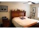 Comfortable bedroom featuring sports memorabilia and a ceiling fan at 4837 Rainbow Race, New Port Richey, FL 34652