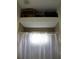 Bathroom shower and tub combination with neutral tile surround at 4837 Rainbow Race, New Port Richey, FL 34652