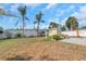 The spacious backyard provides an oasis with lush landscaping, ideal for relaxation at 4932 Gaslight Ave, Holiday, FL 34690