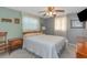 Calming bedroom with a large bed, soft lighting, and soothing color palette at 4932 Gaslight Ave, Holiday, FL 34690