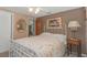 Cozy bedroom featuring a vintage-style bed, soft lighting, and a mirror at 4932 Gaslight Ave, Holiday, FL 34690