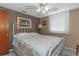 Inviting bedroom with a comfortable bed, soft lighting, and elegant wall art at 4932 Gaslight Ave, Holiday, FL 34690