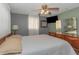 Comfortable bedroom featuring a cozy bed, soft curtains, and ambient lighting at 4932 Gaslight Ave, Holiday, FL 34690