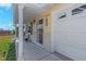 Home exterior with front porch and well-maintained landscaping at 4932 Gaslight Ave, Holiday, FL 34690