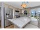 Bright kitchen featuring stainless steel appliances, a spacious island, and backyard access at 4932 Gaslight Ave, Holiday, FL 34690