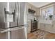 Modern kitchen features stainless steel appliances and a stylish farmhouse sink at 4932 Gaslight Ave, Holiday, FL 34690