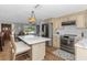Open concept kitchen features an island and stainless steel appliances at 4932 Gaslight Ave, Holiday, FL 34690