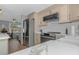 Well-equipped kitchen with a stainless steel refrigerator and modern appliances at 4932 Gaslight Ave, Holiday, FL 34690