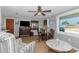 Inviting living space with a dining table, comfortable seating, and bright natural light at 4932 Gaslight Ave, Holiday, FL 34690
