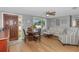 Cozy living room featuring a round table, sofa, and chair near the front door at 4932 Gaslight Ave, Holiday, FL 34690