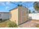 The backyard features a storage shed, offering extra space for gardening or hobbies at 4932 Gaslight Ave, Holiday, FL 34690