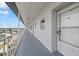 Condo hallway featuring unit door, modern lighting, and lovely city views at 4939 Floramar Ter # 902, New Port Richey, FL 34652