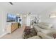 Bright living room featuring modern decor, comfortable seating, and plenty of natural light at 4939 Floramar Ter # 902, New Port Richey, FL 34652