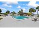 Inviting community pool area with gazebo, lounge chairs, and lush landscaping at 4939 Floramar Ter # 902, New Port Richey, FL 34652
