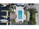 Aerial view of pool, boats, dock, and recreational area providing outdoor enjoyment for residents at 4939 Floramar Ter # 902, New Port Richey, FL 34652