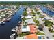 Panoramic aerial view of waterfront homes with private docks, canals, and lush greenery at 5008 Forecastle Dr, New Port Richey, FL 34652