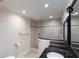 Bathroom featuring a glass shower with a tile surround, handheld shower head, and vanity at 5008 Forecastle Dr, New Port Richey, FL 34652
