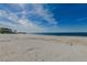 Tranquil beach scene with clear blue skies and soft, sandy shoreline at 5008 Forecastle Dr, New Port Richey, FL 34652