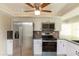 Updated kitchen features stainless steel appliances, granite countertops, and mosaic tile backsplash at 5008 Forecastle Dr, New Port Richey, FL 34652