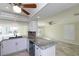 Bright and spacious kitchen with granite countertops, tile flooring, and a view of the outdoor area at 5008 Forecastle Dr, New Port Richey, FL 34652