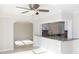 Open kitchen layout with granite countertop bar overlooking the living area at 5008 Forecastle Dr, New Port Richey, FL 34652