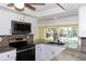 Gourmet kitchen featuring stainless steel appliances and granite countertops overlooking the pool at 5008 Forecastle Dr, New Port Richey, FL 34652