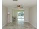 Bright living space features neutral walls and access to outdoor pool area at 5008 Forecastle Dr, New Port Richey, FL 34652