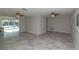 Spacious living room with neutral tile floors and large windows at 5008 Forecastle Dr, New Port Richey, FL 34652