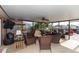 View of a covered patio with wicker furniture and outdoor ceiling fan at 5008 Forecastle Dr, New Port Richey, FL 34652