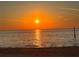 A stunning sunset view on a calm oceanfront, creating a peaceful and scenic atmosphere at 5008 Forecastle Dr, New Port Richey, FL 34652