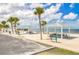 Well-maintained beach with multiple cabanas and picnic areas, ideal for a relaxing day by the sea at 5041 Royal Palms Way # 203, New Port Richey, FL 34652