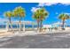 Beach cabana with picnic table and grill alongside beach access, perfect for outdoor enjoyment at 5041 Royal Palms Way # 203, New Port Richey, FL 34652