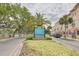 Street view of the New Port Richey welcome sign, showcasing the local neighborhood and surrounding businesses at 5041 Royal Palms Way # 203, New Port Richey, FL 34652