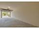 Interior view of the garage showcasing the garage door and concrete floor at 5041 Royal Palms Way # 203, New Port Richey, FL 34652