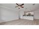 Bright living area with wood floors flowing into an open kitchen with modern appliances at 5041 Royal Palms Way # 203, New Port Richey, FL 34652