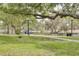 Scenic park with mature trees, walking paths, and benches, offering a tranquil escape in the heart of the community at 5041 Royal Palms Way # 203, New Port Richey, FL 34652