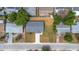 Drone shot of well-maintained home with gray roof, freshly cut lawn, and proximity to neighborhood amenities at 5214 Idlewild St, New Port Richey, FL 34653