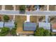 Aerial view of single-story home with a large front yard and long driveway leading to a two-car garage at 5214 Idlewild St, New Port Richey, FL 34653