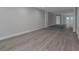 This basement offers tons of space, grey wood-look floors, and white trim at 5214 Idlewild St, New Port Richey, FL 34653