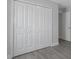 A large closet features clean white doors with hardware and wood-look floors at 5214 Idlewild St, New Port Richey, FL 34653
